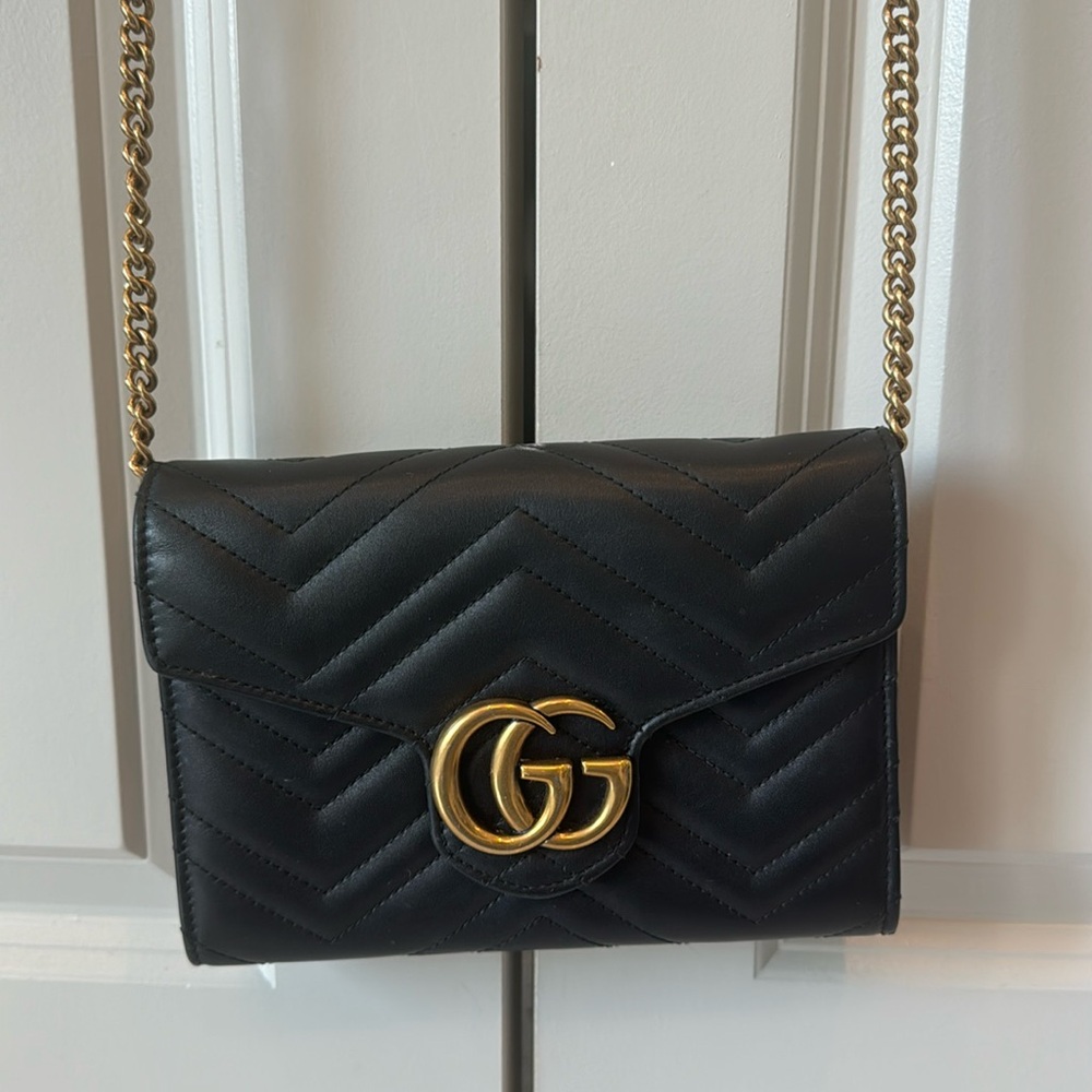 GUCCI Matelasse GG Black Leather and gold chain flap crossbody bag